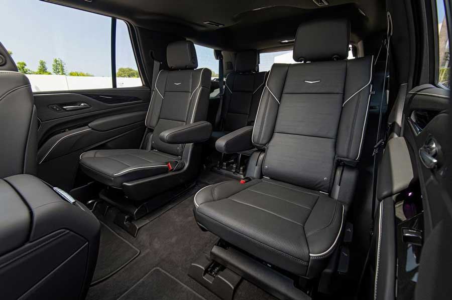 Cadillac Escalade ESV interior with quilted leather seats and gold ambient lighting