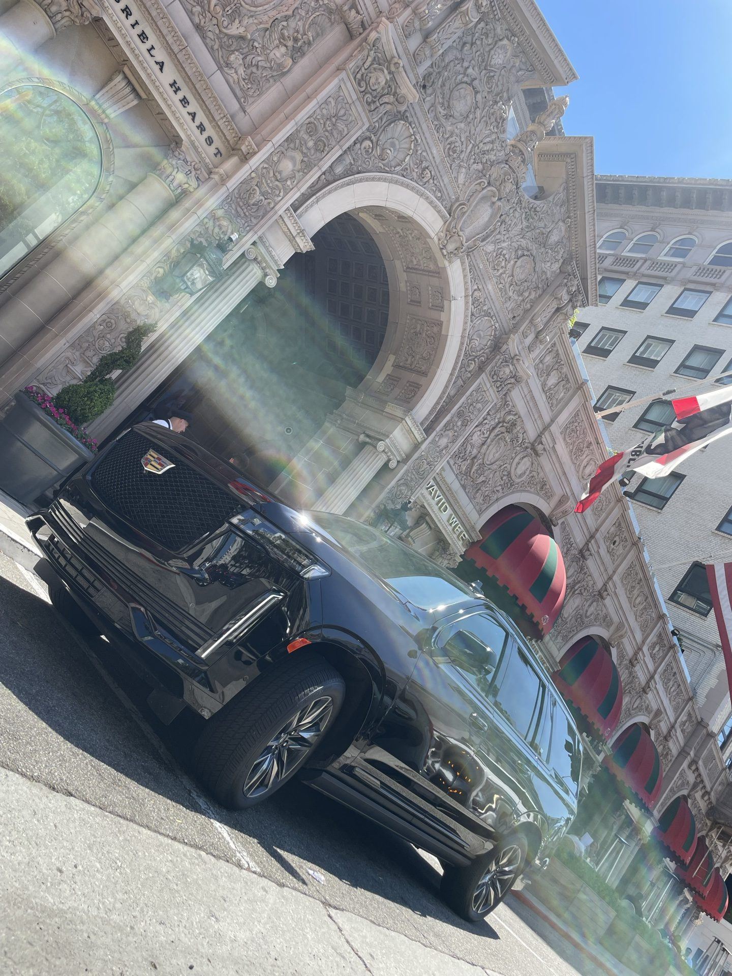 Continental Cadillac Escalade at a luxury hotel entrance — Pasadena car service, Los Angeles